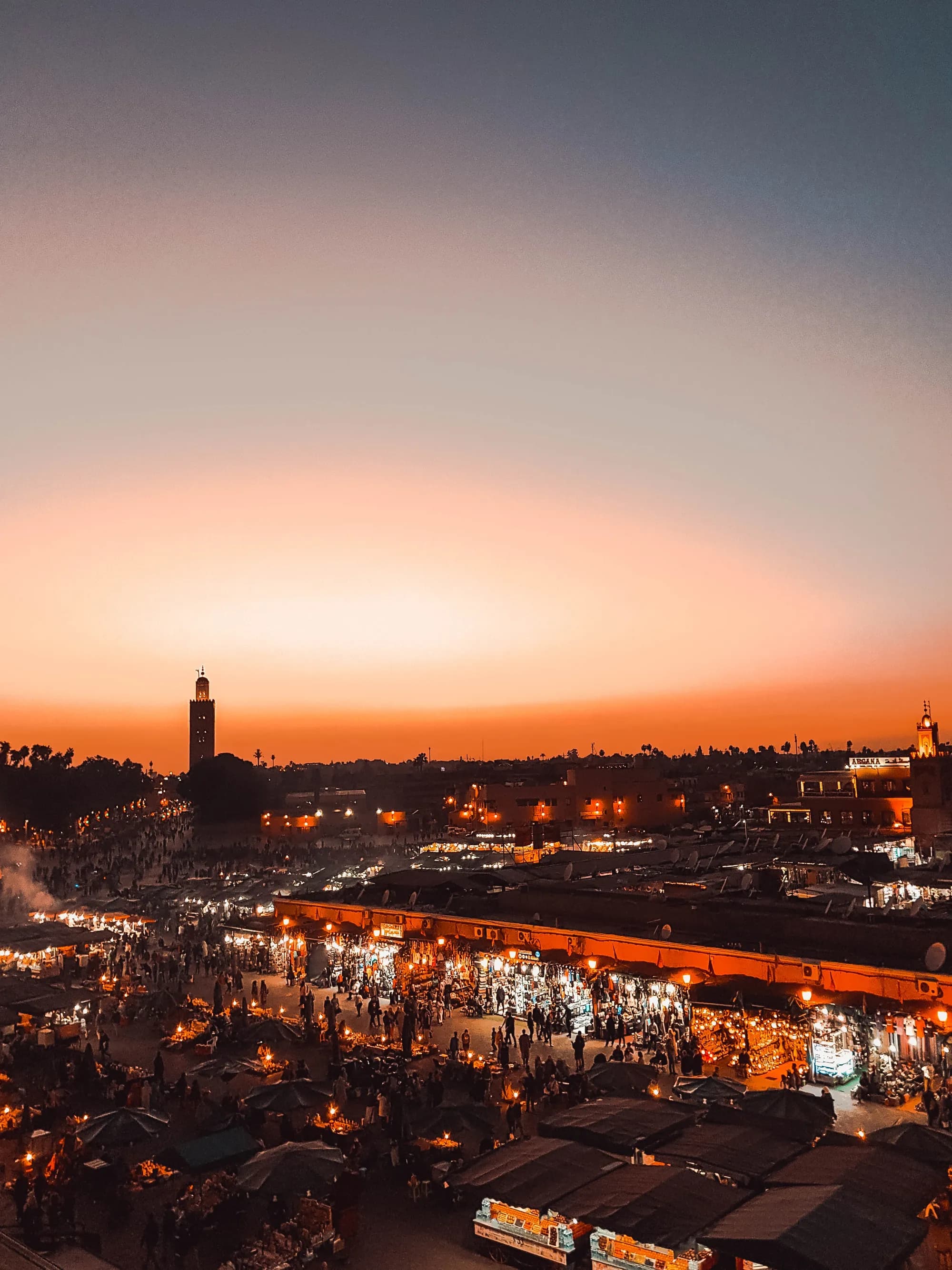 Jemaa el-Fnaa square and the Koutoubia minaret at sunset, Marrakech, Morocco